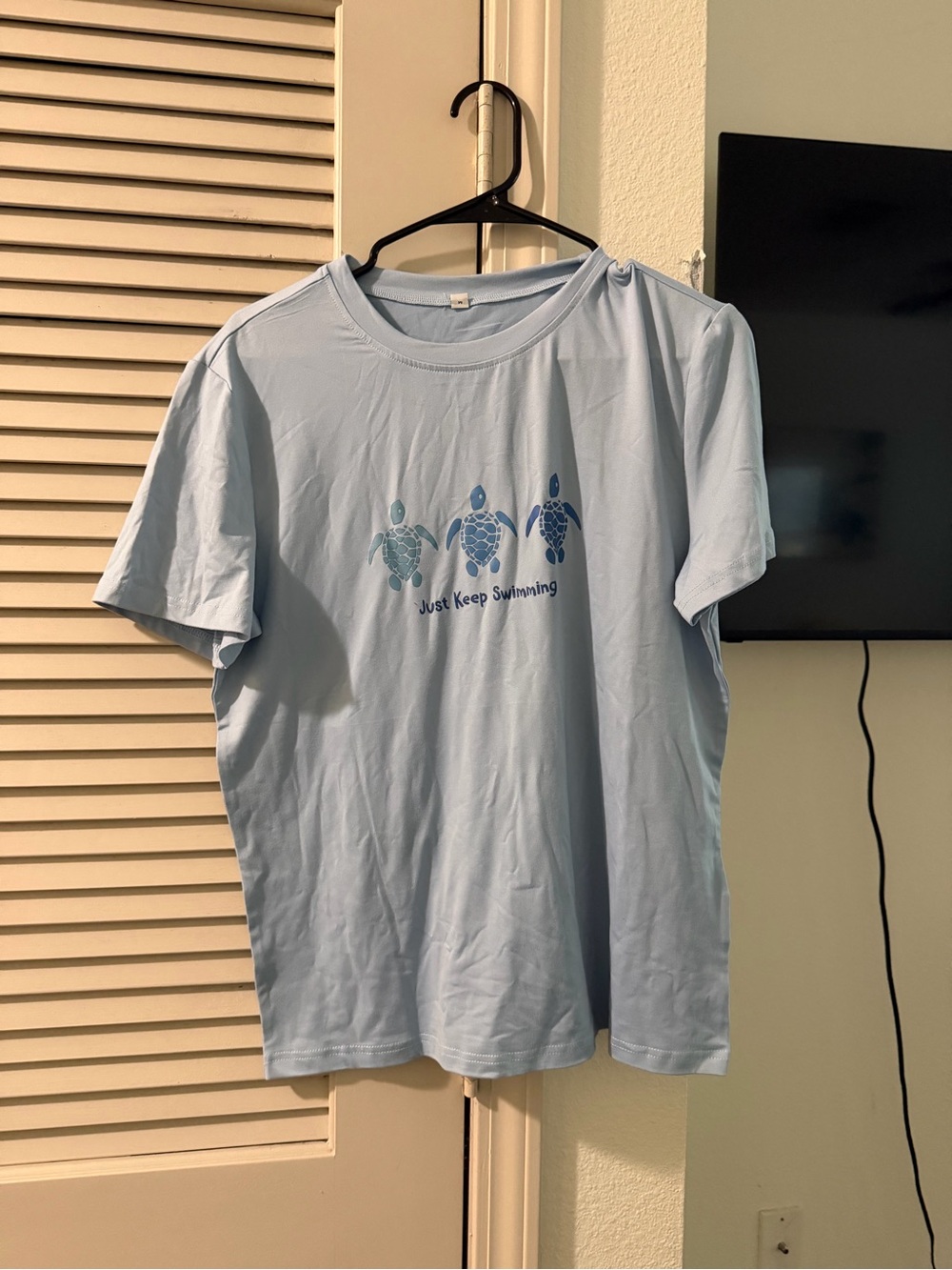 Light Blue Women’s Graphic Tee - 'Just Keep Swimming'